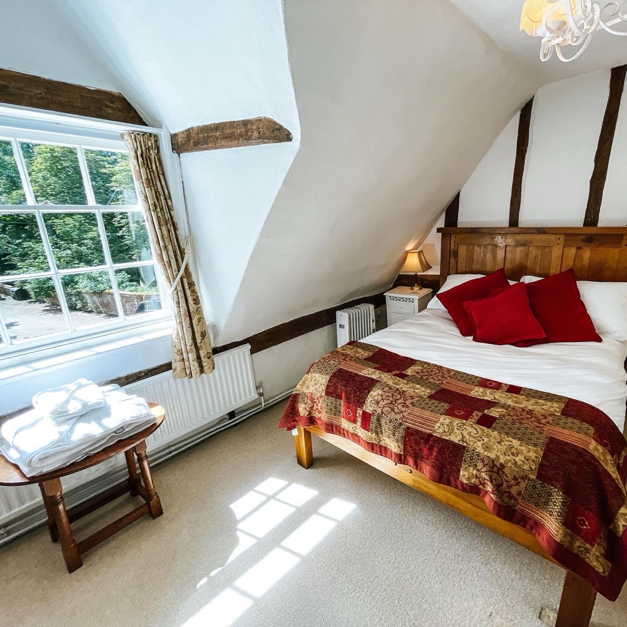 The Lark inn room at The Peacock Inn, a traditional room facing south over the humpback bridge with charming oak beams