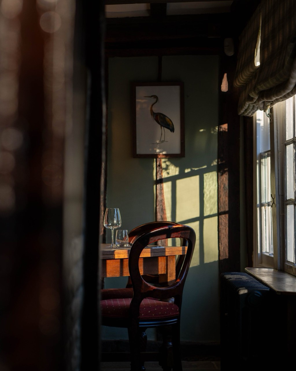 The warm beamed interior of The Peacock Inn set for a private gathering