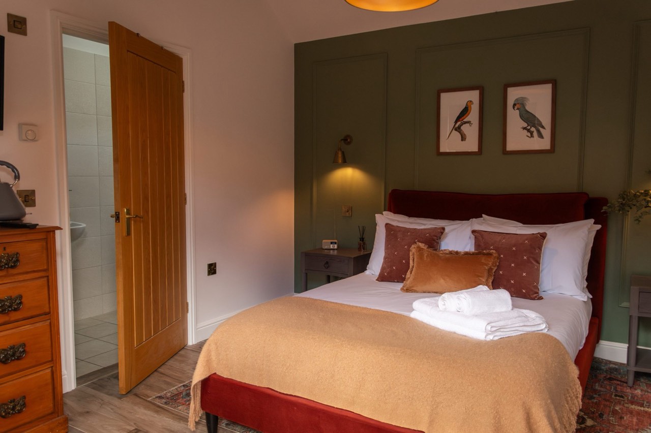 The Orwell garden room at The Peacock Inn, a warm and inviting room located next to the garden