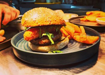Steak Burger on Sourdough & Seasame Bun, Tomato Chutney, Pickles, Rocket, Smoked Cheddar Croquette & Triple Cooked Chips